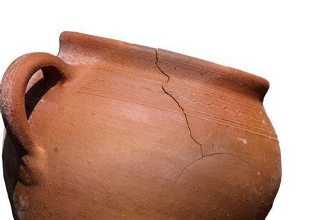 Cracked pot - The perfect pot mocks the cracked pot, but the cr... Every day a woman carries two pots of water from the river to her home. One is perfect, and one is cracked.